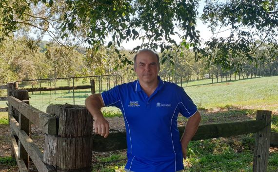 Lukas - paddock pose Lukas Van Zweiten in a blue shirt leans on a fence in a paddock